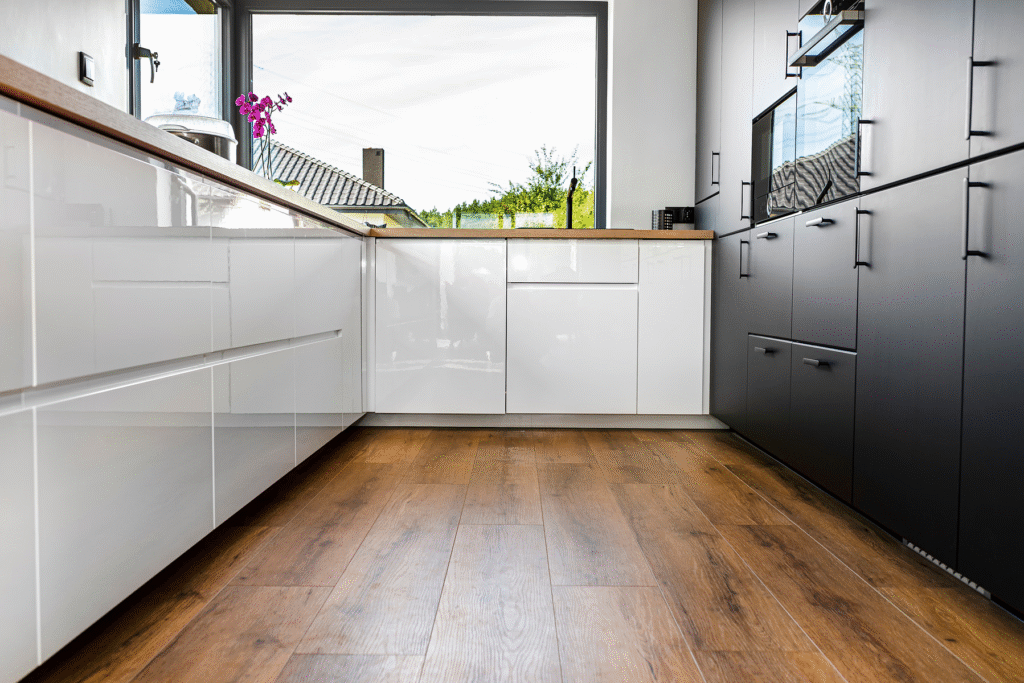 oak effect vinyl plank flooring in modern kitchen